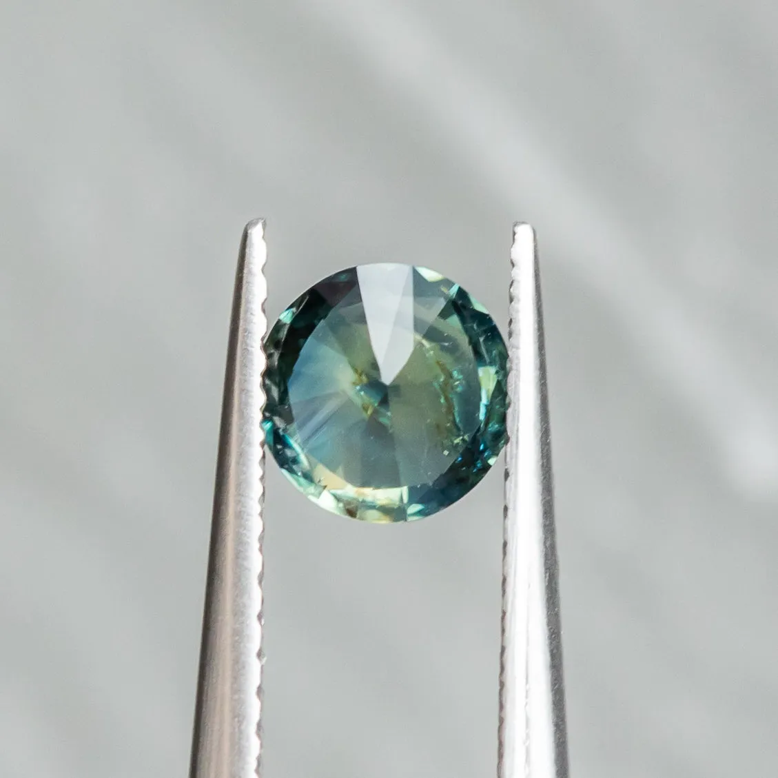 1.03CT ROUND NIGERIAN SAPPHIRE, TEAL BLUE GREEN, 6.02X3.83MM, UNTREATED