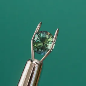 1.10CT ROUND NIGERIAN SAPPHIRE, DEEP TEAL BLUE GREEN, 6.19X4.73MM, UNTREATED